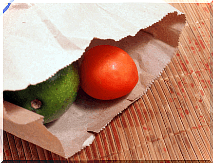 Avocado with tomato in paper bag