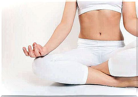 Woman sitting in a yoga pose