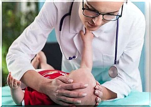 Doctor examines baby's head