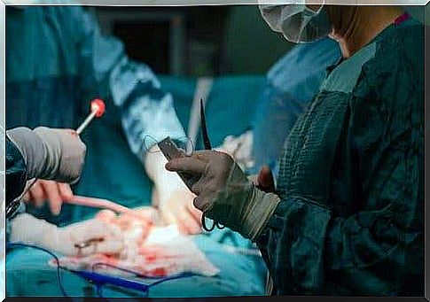 A doctor performs a hysterectomy