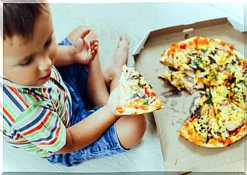 A child eating pizza