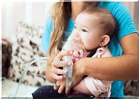 A baby wearing an oxygen mask