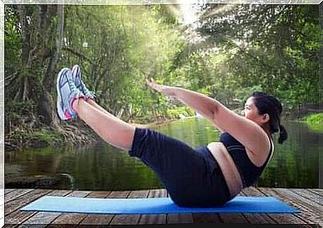 A woman is doing fitness exercises outside