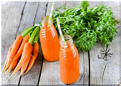 Carrot juice with a straw