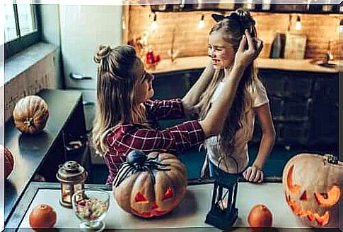 Mother prepares child for Halloween