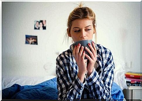 A woman drinks tea