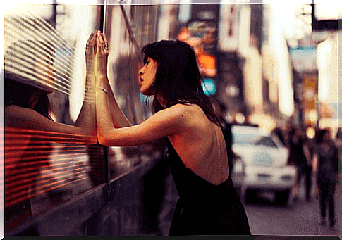 Woman in front of window