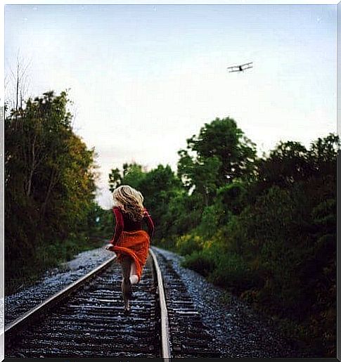 Woman running on track