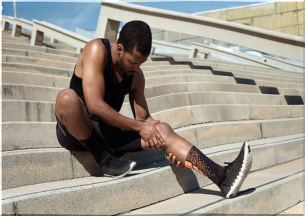 Boy with a cramp in his calf