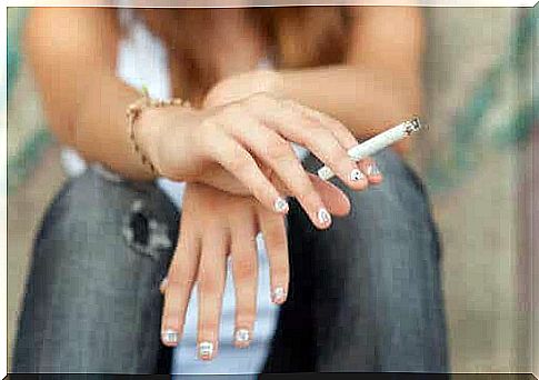 Woman with a cigarette between her fingers